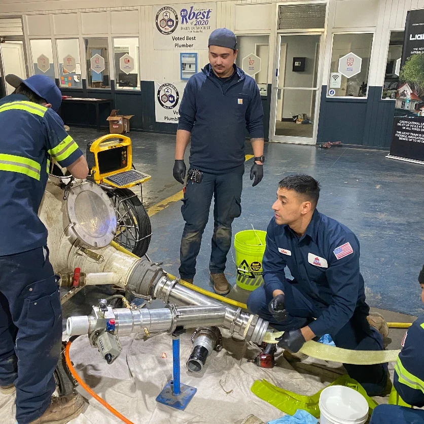 bell plumbers working on pipe lining